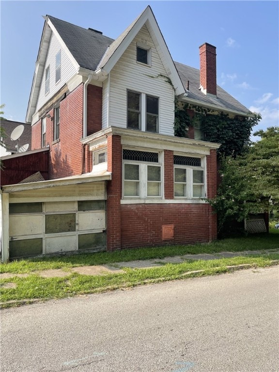 view of side of home with a garage