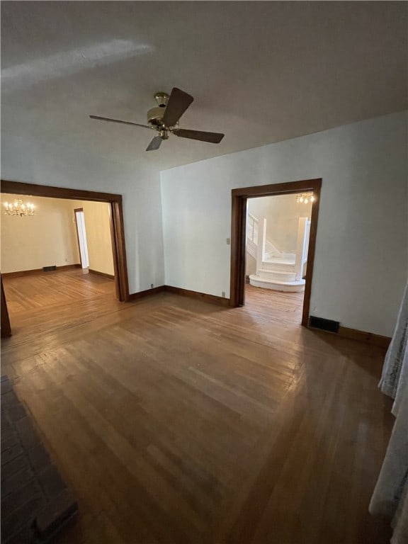 unfurnished room featuring ceiling fan and hardwood / wood-style floors