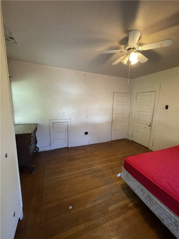 bedroom featuring wood-type flooring and ceiling fan