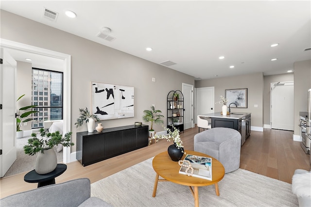 living room with light hardwood / wood-style flooring