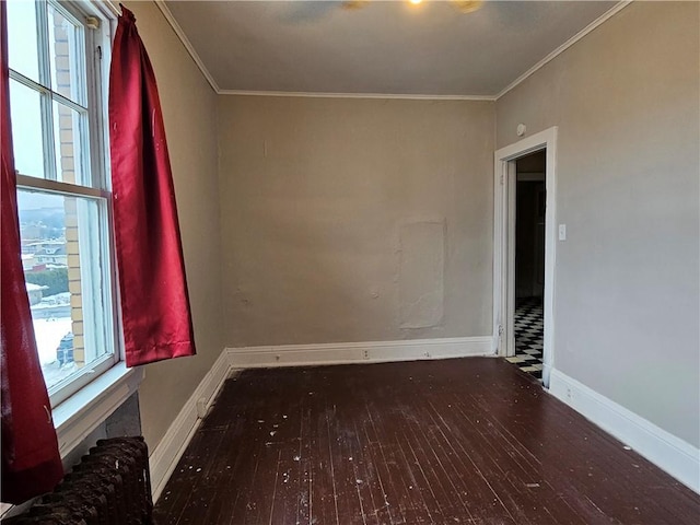 unfurnished room featuring dark hardwood / wood-style floors and crown molding