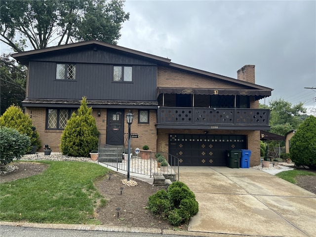 view of front facade with a balcony and a garage