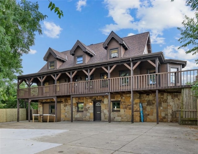 view of front of house featuring roof with shingles