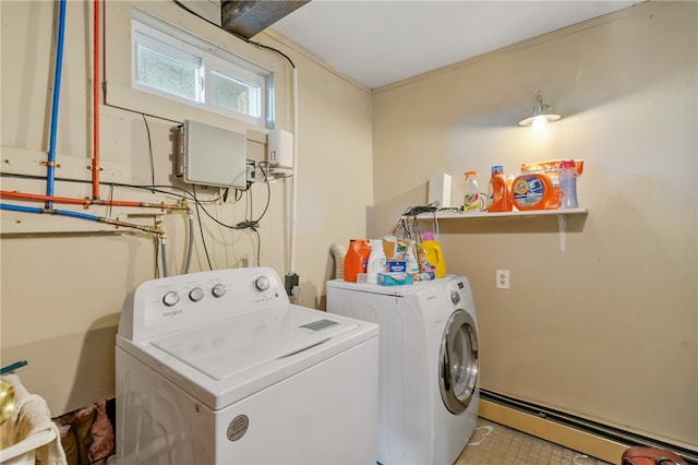 washroom with light tile patterned flooring, a baseboard heating unit, and separate washer and dryer