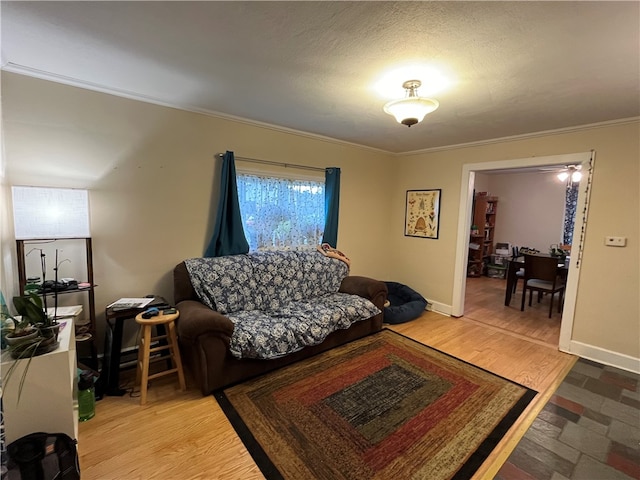 living room with crown molding and hardwood / wood-style floors