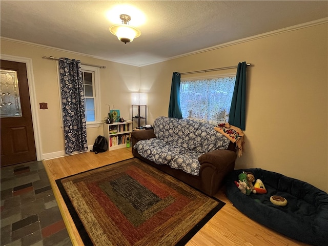 living room featuring hardwood / wood-style flooring and crown molding