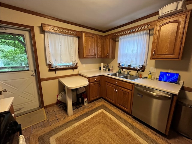 kitchen with a wealth of natural light, sink, tile patterned flooring, and dishwasher