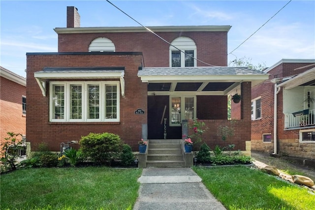 traditional home with a front yard, brick siding, and a chimney