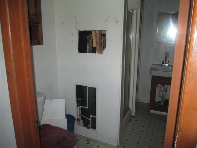 bathroom featuring tile patterned floors and toilet