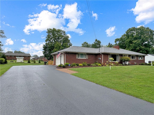 ranch-style house with a front lawn and a garage