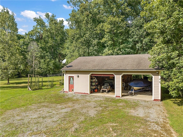 garage featuring a yard