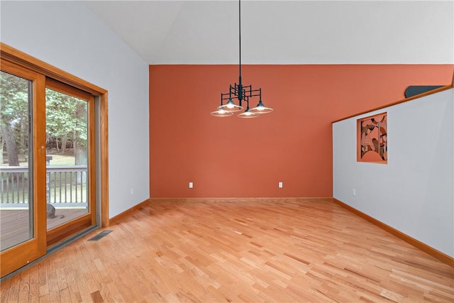 unfurnished room featuring baseboards, visible vents, high vaulted ceiling, an inviting chandelier, and light wood-style flooring