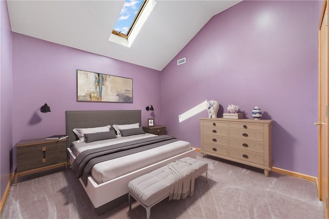 bedroom featuring lofted ceiling with skylight, visible vents, baseboards, and carpet