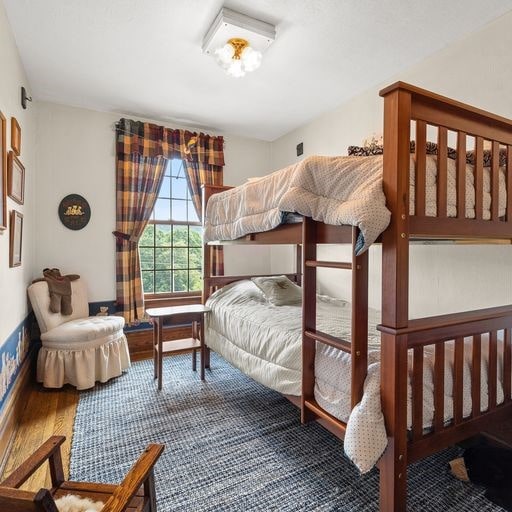 bedroom with wood-type flooring