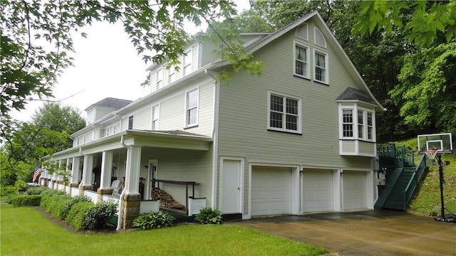 exterior space featuring covered porch and a garage