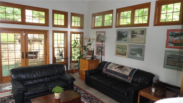 tiled living room featuring french doors