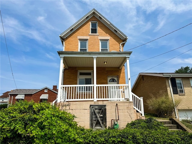 view of front of home with a garage and a porch