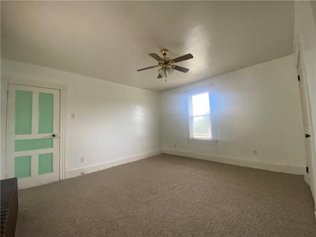 unfurnished room featuring ceiling fan and carpet flooring