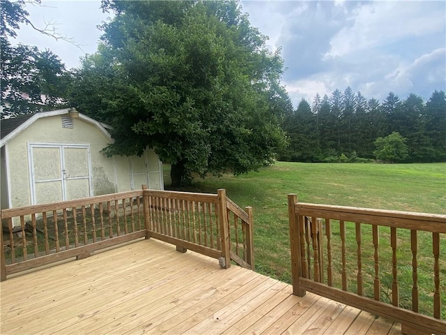 deck featuring a yard and a shed