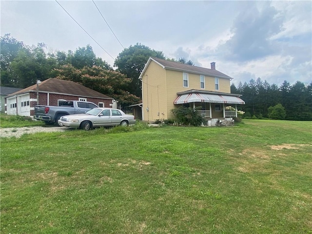 exterior space with a porch and a lawn