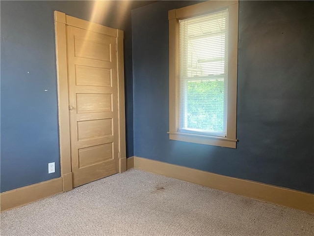 unfurnished room featuring carpet flooring