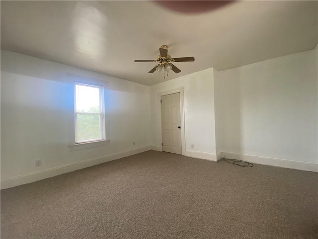 empty room featuring carpet and ceiling fan