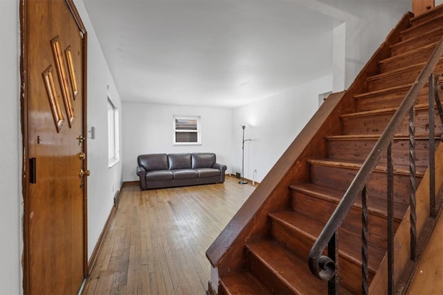 staircase featuring wood-type flooring