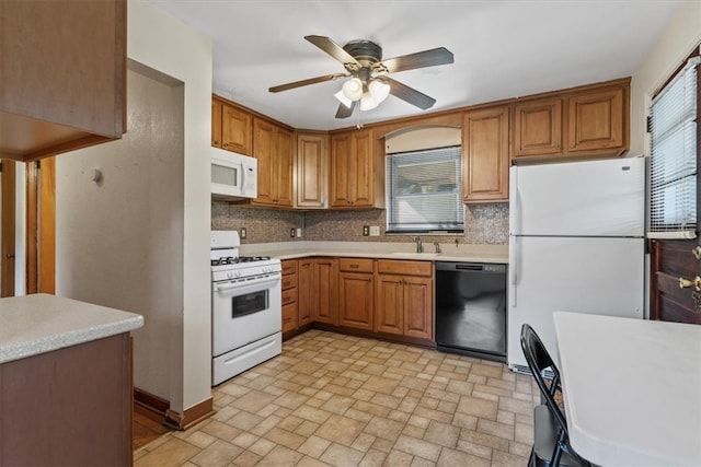 kitchen featuring ceiling fan, backsplash, sink, light tile patterned flooring, and white appliances