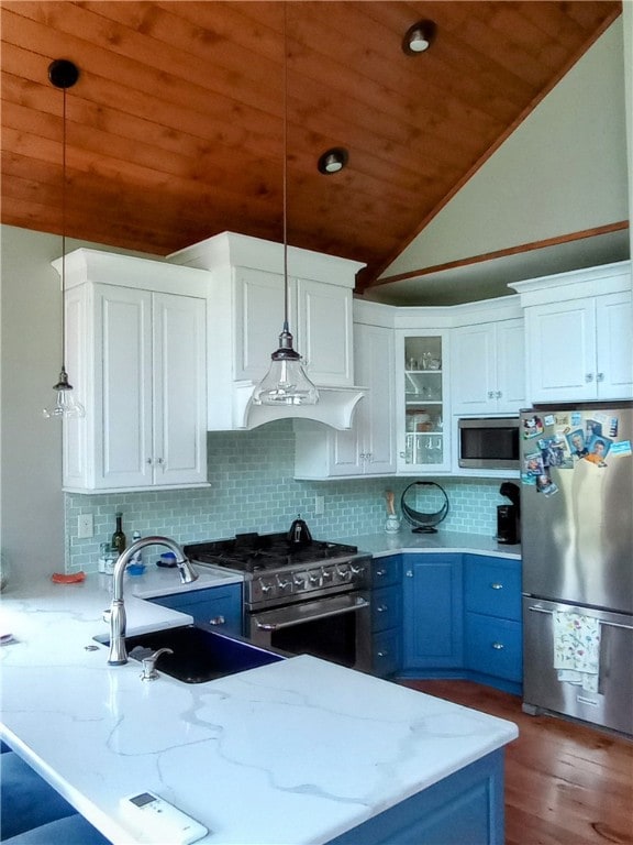 kitchen with backsplash, wood ceiling, blue cabinetry, vaulted ceiling, and stainless steel appliances