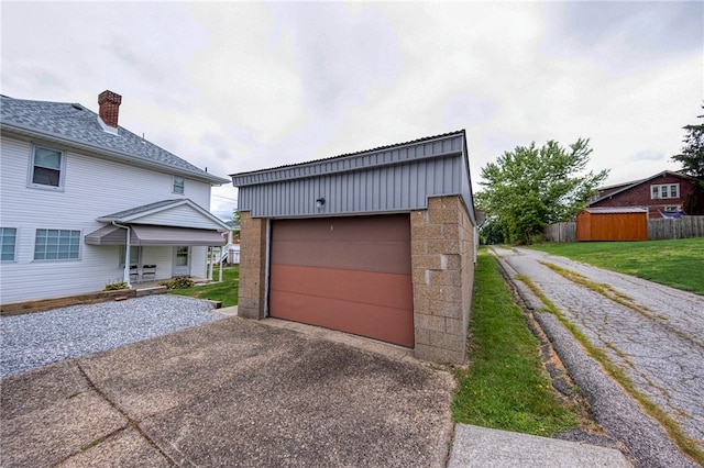 garage with a lawn