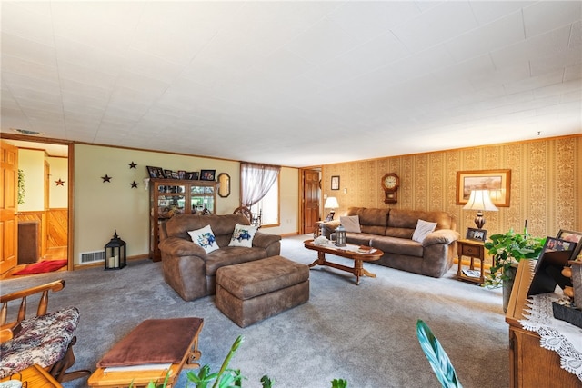 living room with wood walls and carpet