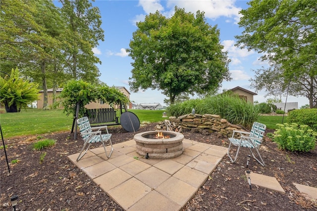 view of patio with a fire pit