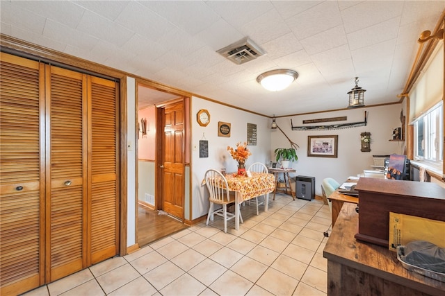 home office with light tile patterned floors