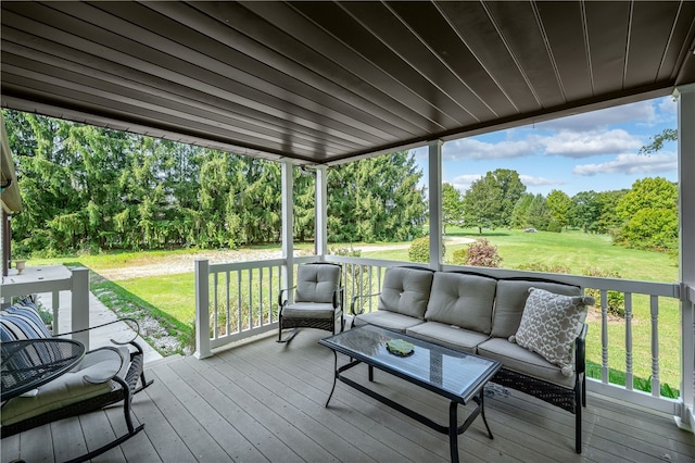 deck with a yard and outdoor lounge area