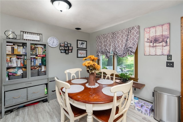 dining area with hardwood / wood-style flooring