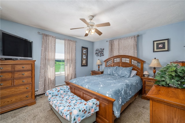 carpeted bedroom with a textured ceiling and ceiling fan