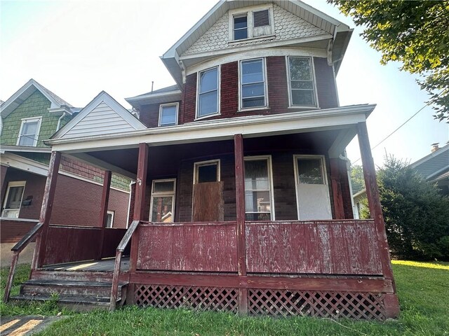 view of front of property featuring covered porch