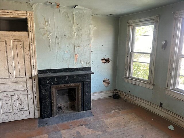 unfurnished living room with hardwood / wood-style flooring