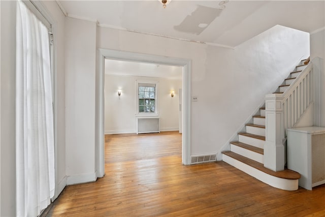 interior space featuring light wood-type flooring and radiator