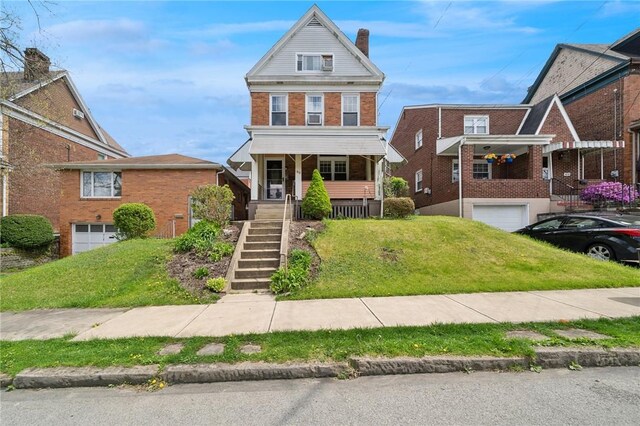 view of front facade with a porch and a front yard