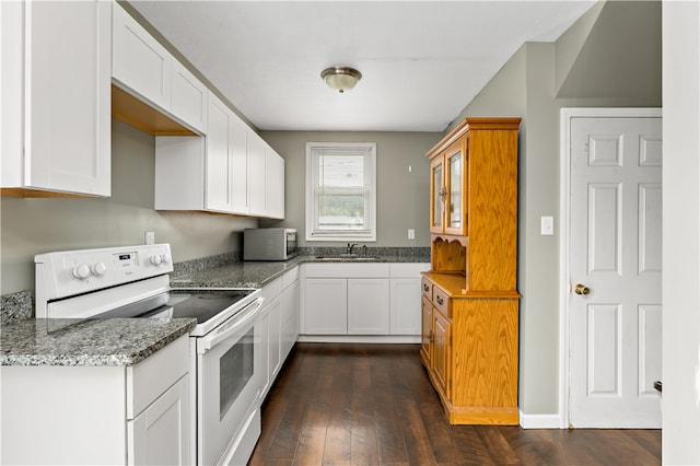 kitchen with sink, stone countertops, dark hardwood / wood-style floors, white range with electric cooktop, and white cabinets