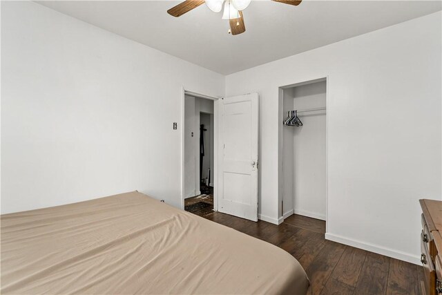 bedroom with a closet, ceiling fan, and dark hardwood / wood-style floors