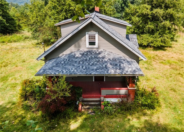 view of property exterior with a lawn