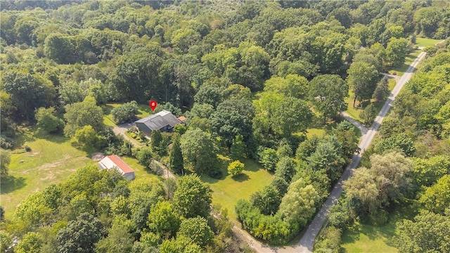 drone / aerial view featuring a forest view