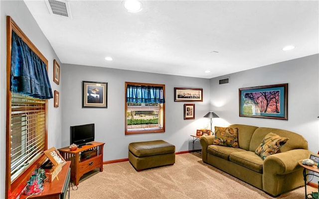 living room featuring recessed lighting, baseboards, visible vents, and carpet floors