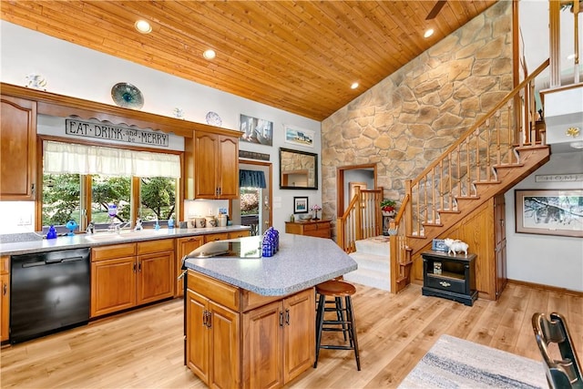 kitchen with wooden ceiling, a center island, light wood-style floors, and black dishwasher