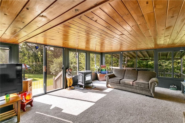 sunroom featuring wooden ceiling and a wood stove