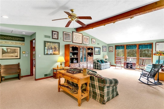 living room featuring visible vents, ceiling fan, baseboards, lofted ceiling with beams, and carpet flooring