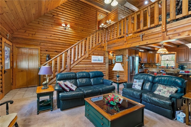 tiled living room with high vaulted ceiling, log walls, and wooden ceiling