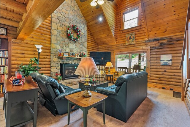 carpeted living room featuring high vaulted ceiling, a fireplace, ceiling fan, wood ceiling, and rustic walls